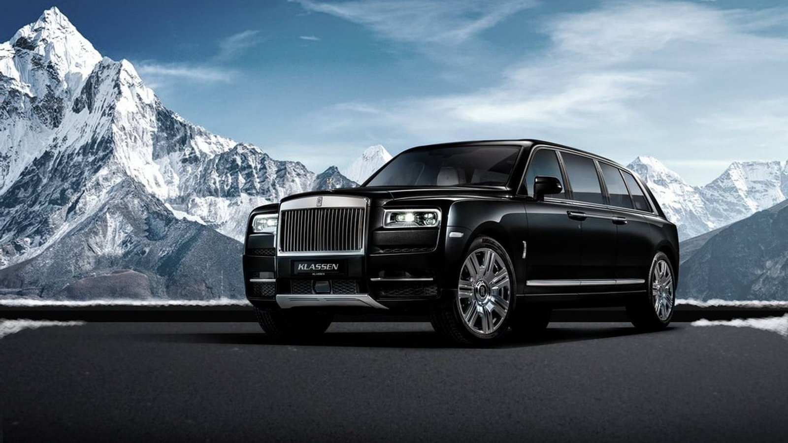 Luxury black SUV limousine parked in front of snowy mountains, added in blog post highlighting common limo booking mistakes to avoid in Ontario.